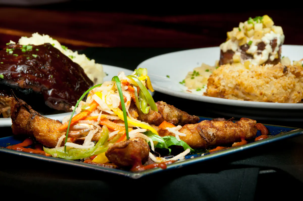 a plate of food with rice meat and vegetables
